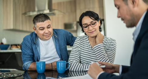 Financial advisor meeting with a couple at home.