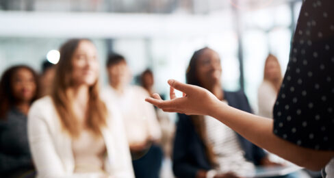 Cropped shot of a businesswoman delivering a speech during a conference